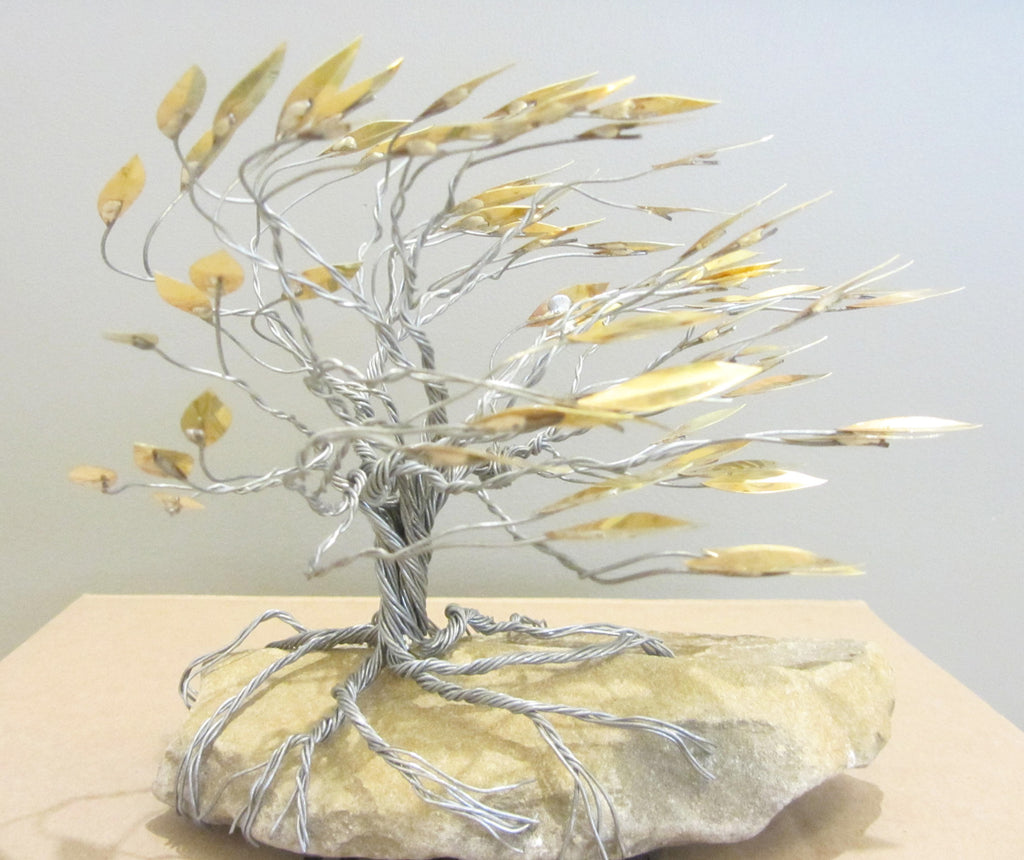 Deeply Rooted Windblown Tree With Gold Leaves Metal Sculpture Lake
